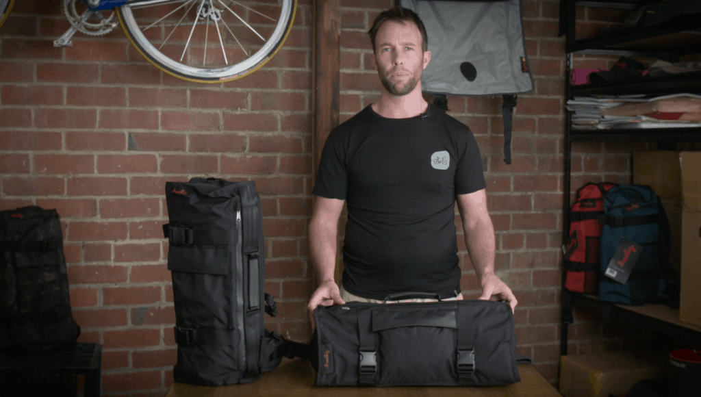 Jeremy from Henty stands behind a black Henty 20L Inner bag.