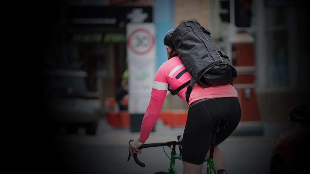 Wingman Suit Bag Backpack worn by cyclist riding to work.