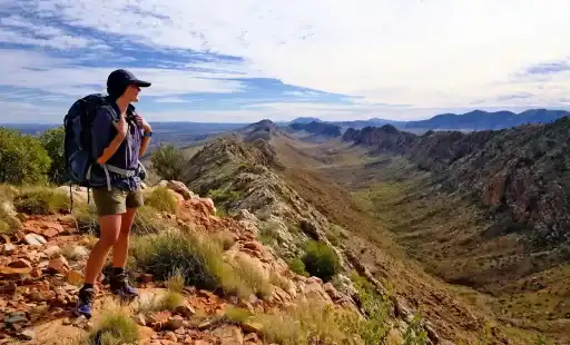 female hiker viewing the Larapinta trail